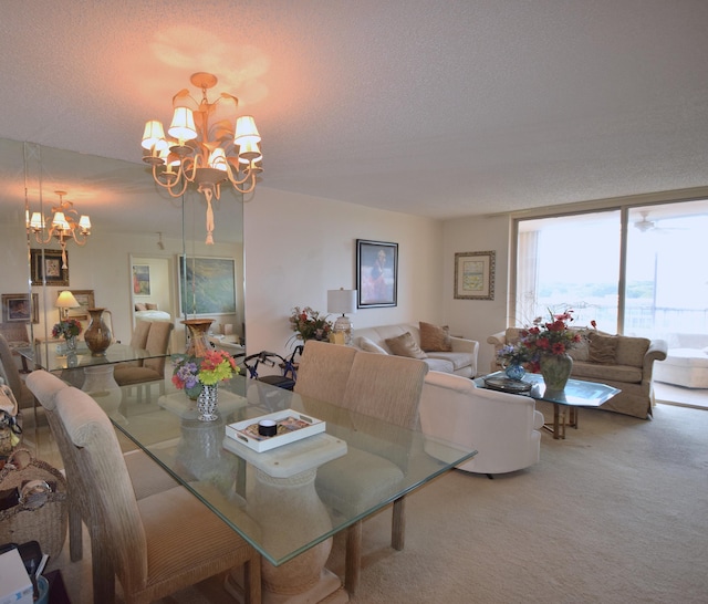 dining room with a textured ceiling, a chandelier, floor to ceiling windows, and carpet floors