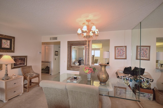 carpeted living room featuring an inviting chandelier and a textured ceiling