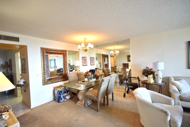 carpeted dining space with an inviting chandelier and a textured ceiling