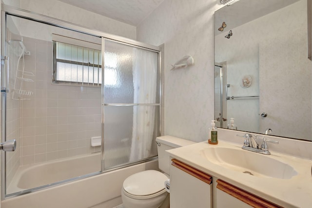 full bathroom with toilet, enclosed tub / shower combo, and vanity