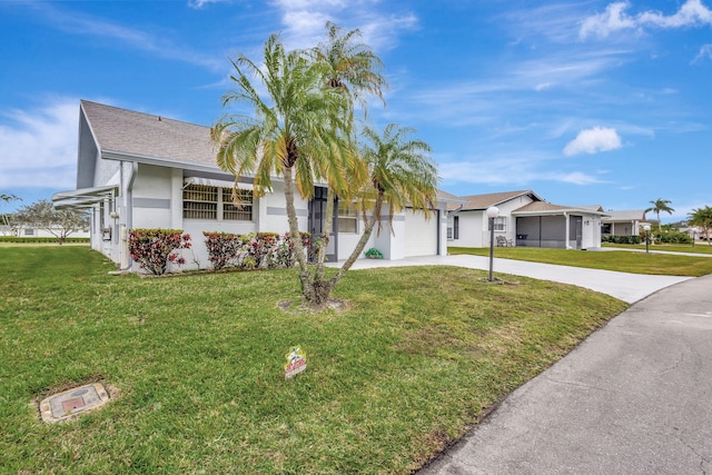 ranch-style house with a front yard and a garage