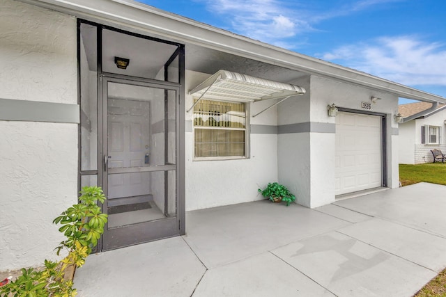 entrance to property featuring a garage