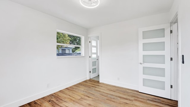 spare room with light wood-type flooring