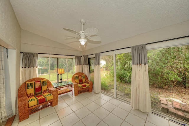 sunroom / solarium with lofted ceiling and ceiling fan