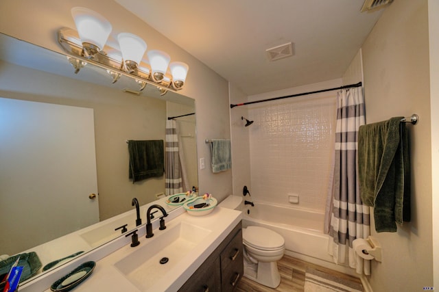 full bathroom featuring wood-type flooring, toilet, vanity, and shower / tub combo with curtain