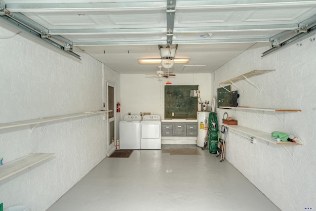 garage featuring separate washer and dryer and electric water heater