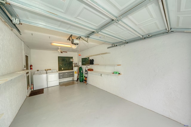 garage with ceiling fan, independent washer and dryer, a garage door opener, and gas water heater