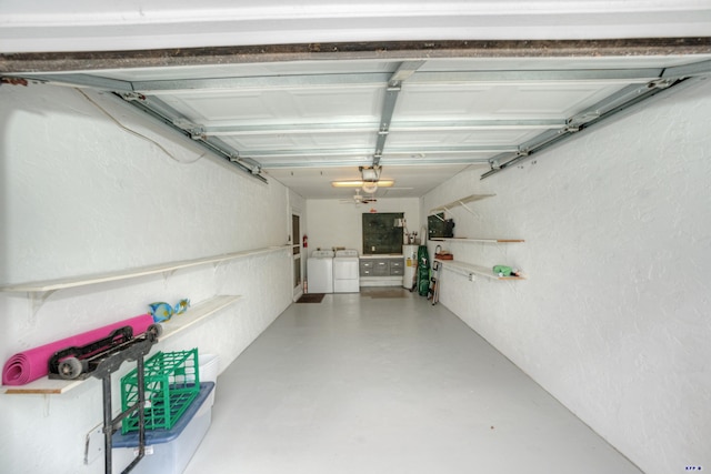 garage with separate washer and dryer and water heater