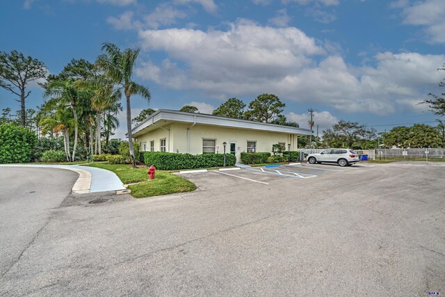 property entrance featuring a garage and a yard