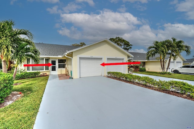 ranch-style home with a front yard and a garage