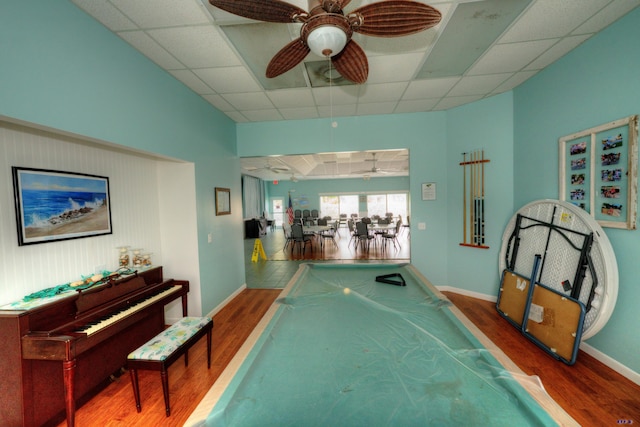 game room with a paneled ceiling, pool table, hardwood / wood-style floors, and ceiling fan