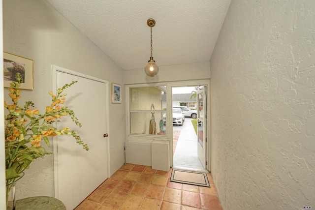 foyer featuring a textured ceiling