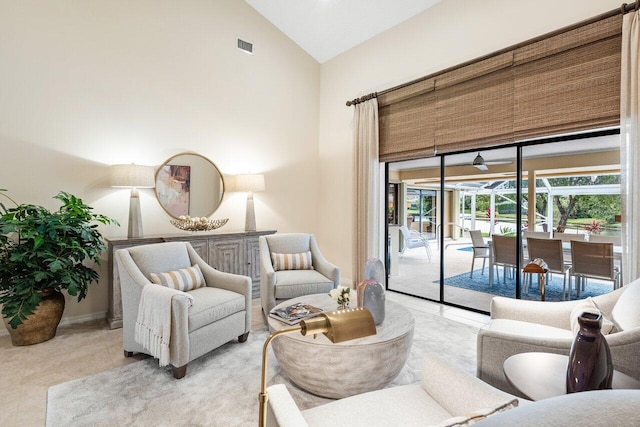 living room featuring high vaulted ceiling