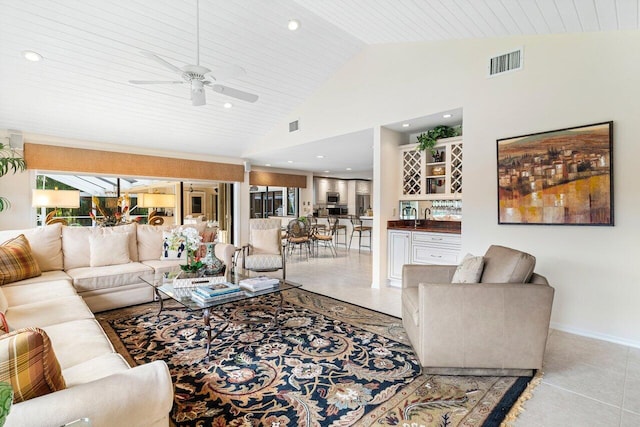 tiled living room with vaulted ceiling, indoor bar, wooden ceiling, and ceiling fan