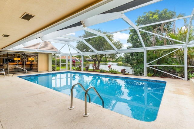 view of swimming pool featuring a water view, a lanai, and a patio