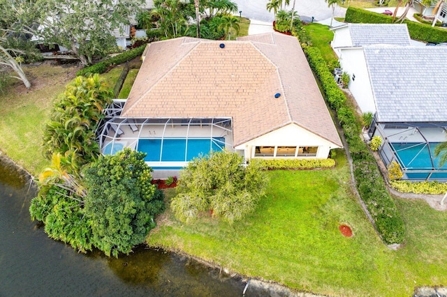 birds eye view of property with a water view