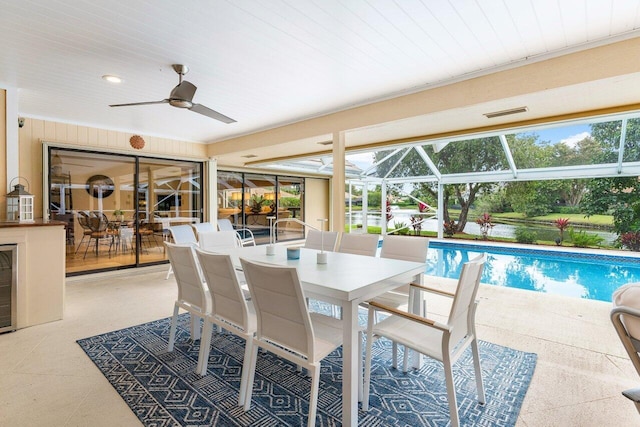 view of pool featuring ceiling fan