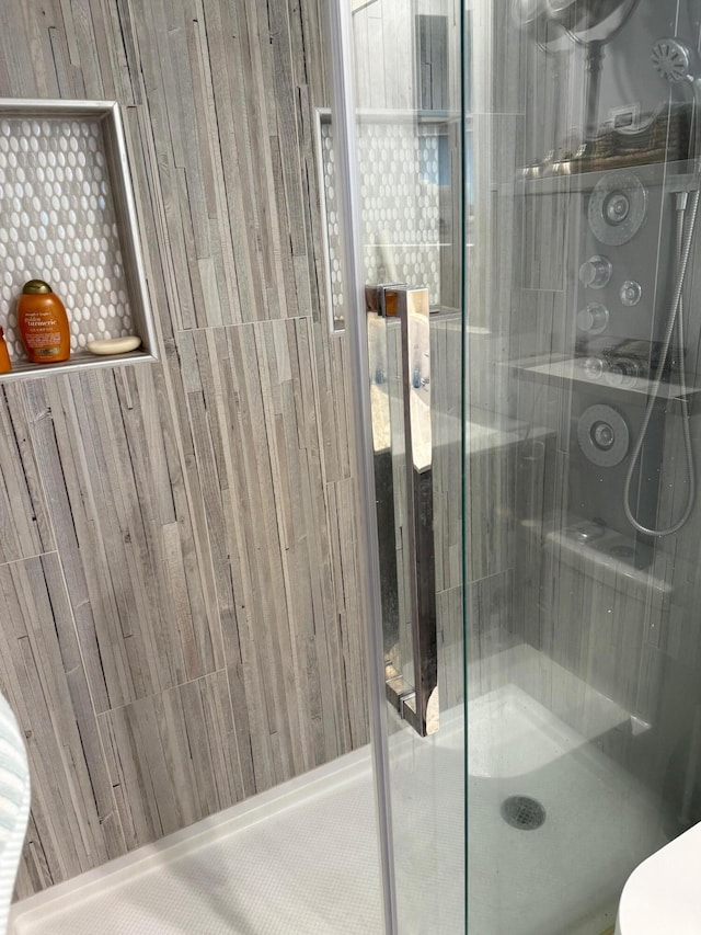 bathroom featuring an enclosed shower