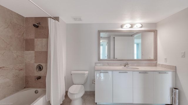 full bathroom with toilet, tile patterned floors, vanity, and shower / bath combo