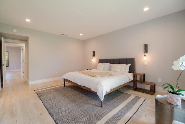 bedroom with light hardwood / wood-style flooring