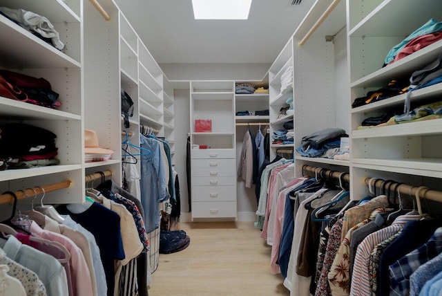 spacious closet featuring light hardwood / wood-style flooring