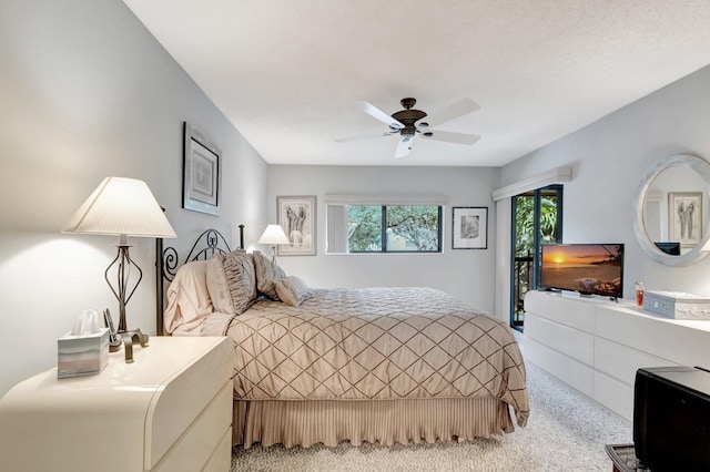 bedroom featuring light colored carpet and ceiling fan