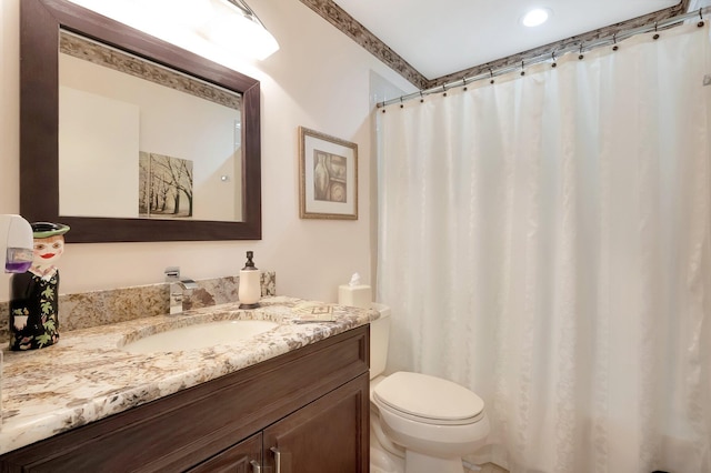 full bath featuring toilet and vanity