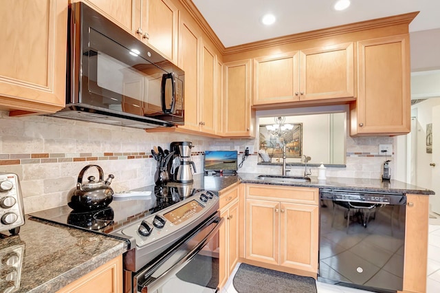 kitchen with light brown cabinets, black appliances, and a sink