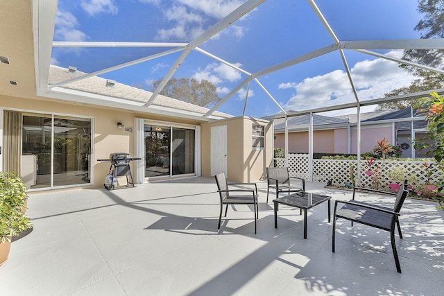 view of patio / terrace featuring a lanai