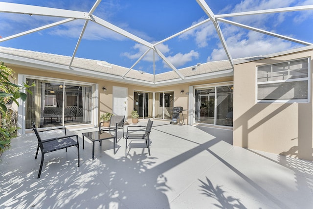 view of patio / terrace with a lanai