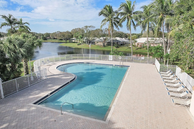 view of swimming pool with a water view