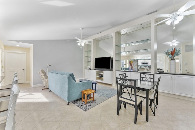 tiled living room with built in shelves and vaulted ceiling