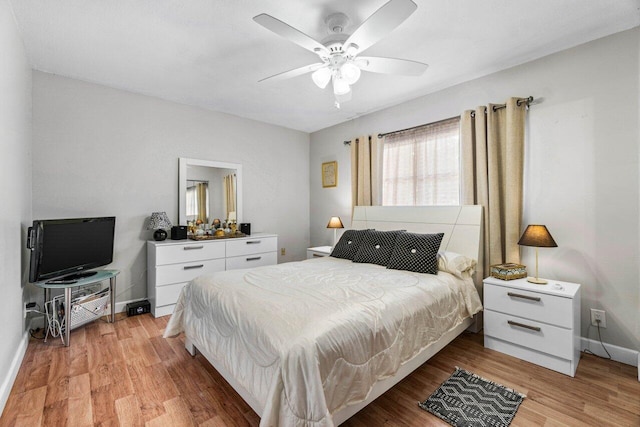 bedroom featuring ceiling fan and light hardwood / wood-style floors