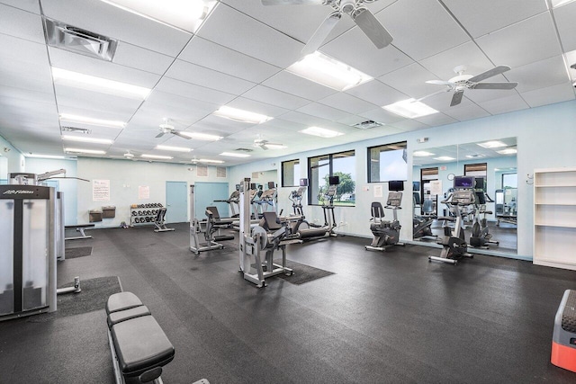 gym featuring a paneled ceiling and ceiling fan