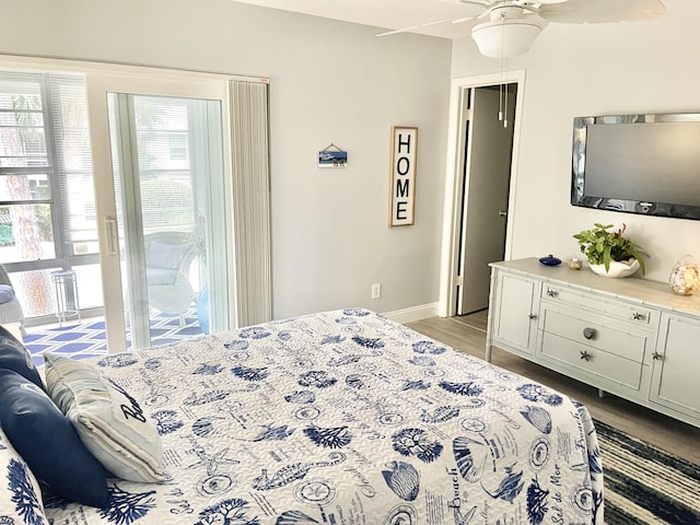 bedroom with light wood-type flooring, ceiling fan, and access to outside