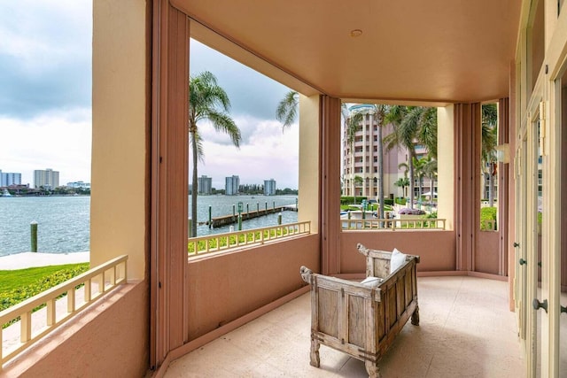 sunroom / solarium with a water view