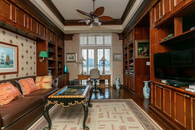 living room with ceiling fan, hardwood / wood-style floors, and crown molding