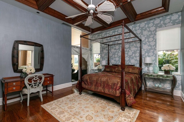 bedroom with coffered ceiling, ceiling fan, and hardwood / wood-style flooring