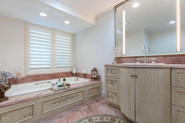 bathroom with crown molding, vanity, and a bathing tub