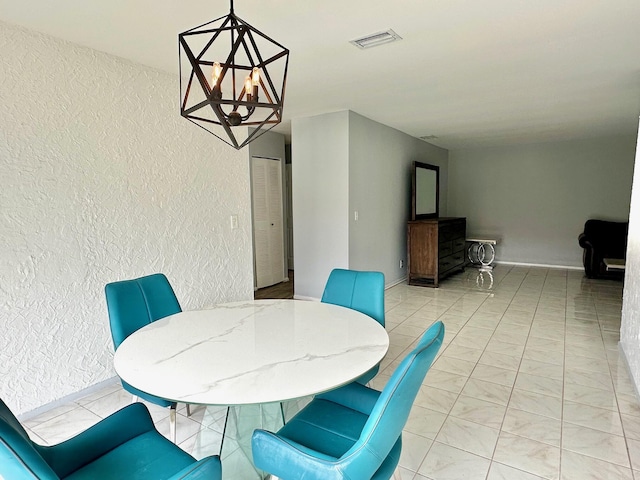 dining area featuring a chandelier