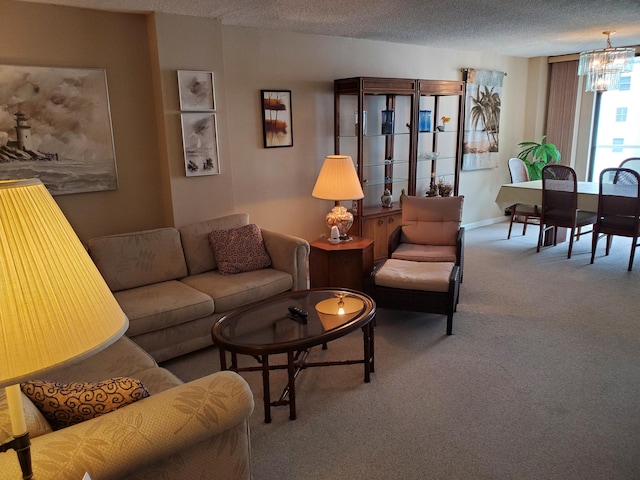 carpeted living room featuring a textured ceiling and an inviting chandelier