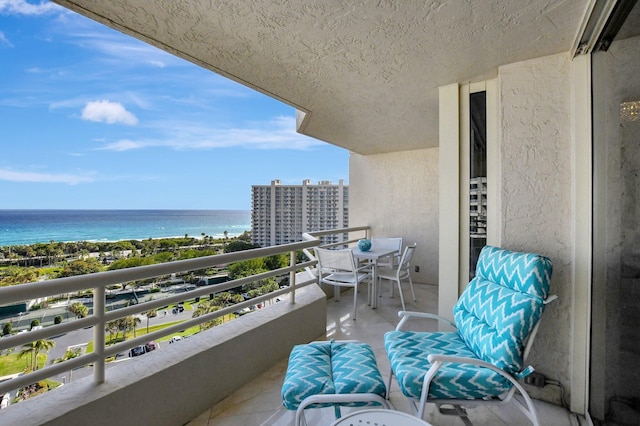 balcony featuring a water view