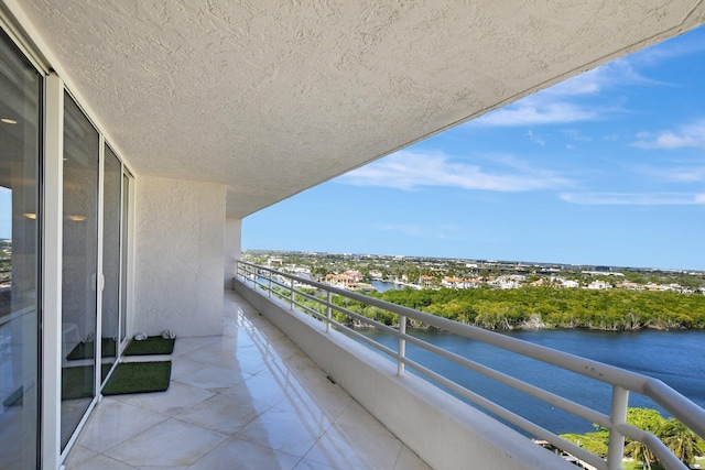 balcony featuring a water view