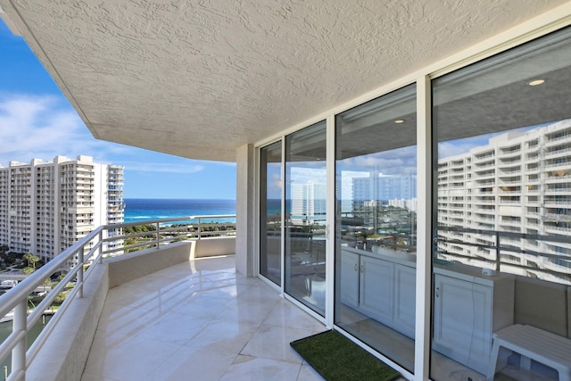 balcony featuring a water view