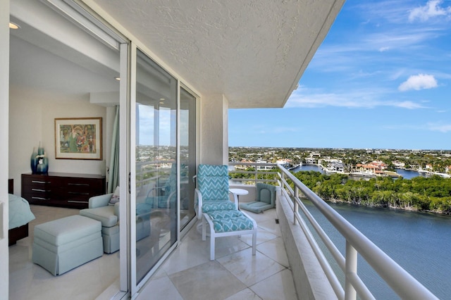 balcony featuring a water view