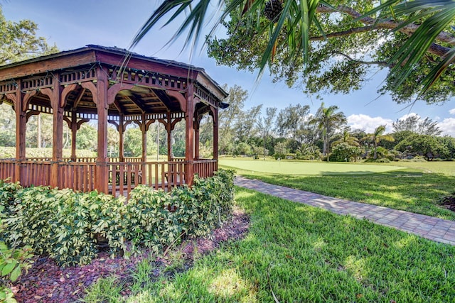 surrounding community with a gazebo and a yard