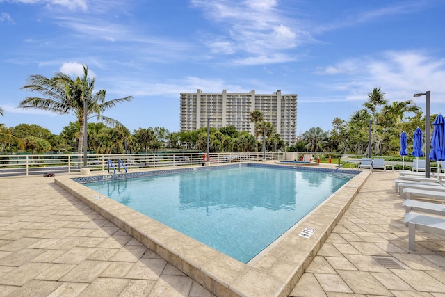 view of swimming pool featuring a patio area