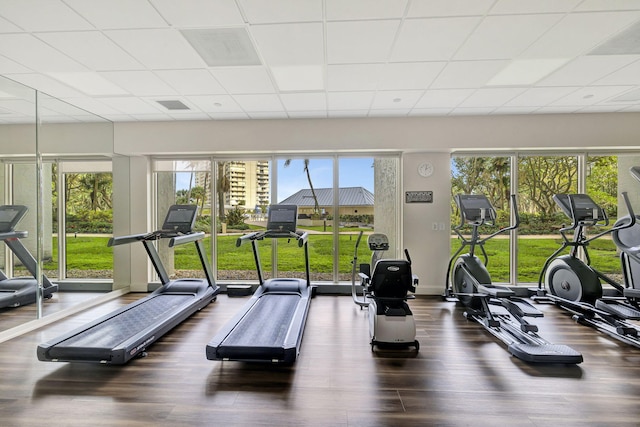 gym featuring a paneled ceiling