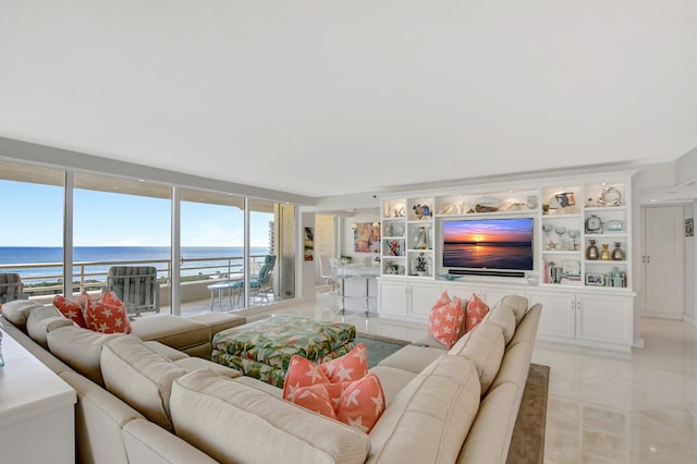 tiled living room with a water view and expansive windows