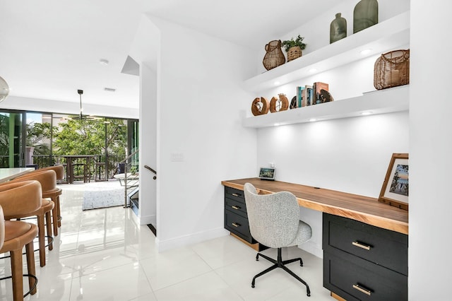 tiled office featuring built in desk